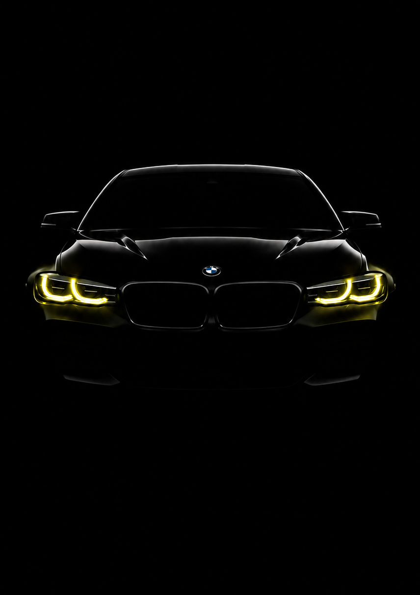 A framed black car poster featuring a front-facing BMW with glowing yellow headlights on a solid black background, presented in a sleek black frame.