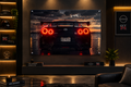A large framed wall art print showing the rear view of a black Nissan GT-R R35 car at sunset, displayed in a modern living room setting with a sofa, shelf, and illuminated wall decor.