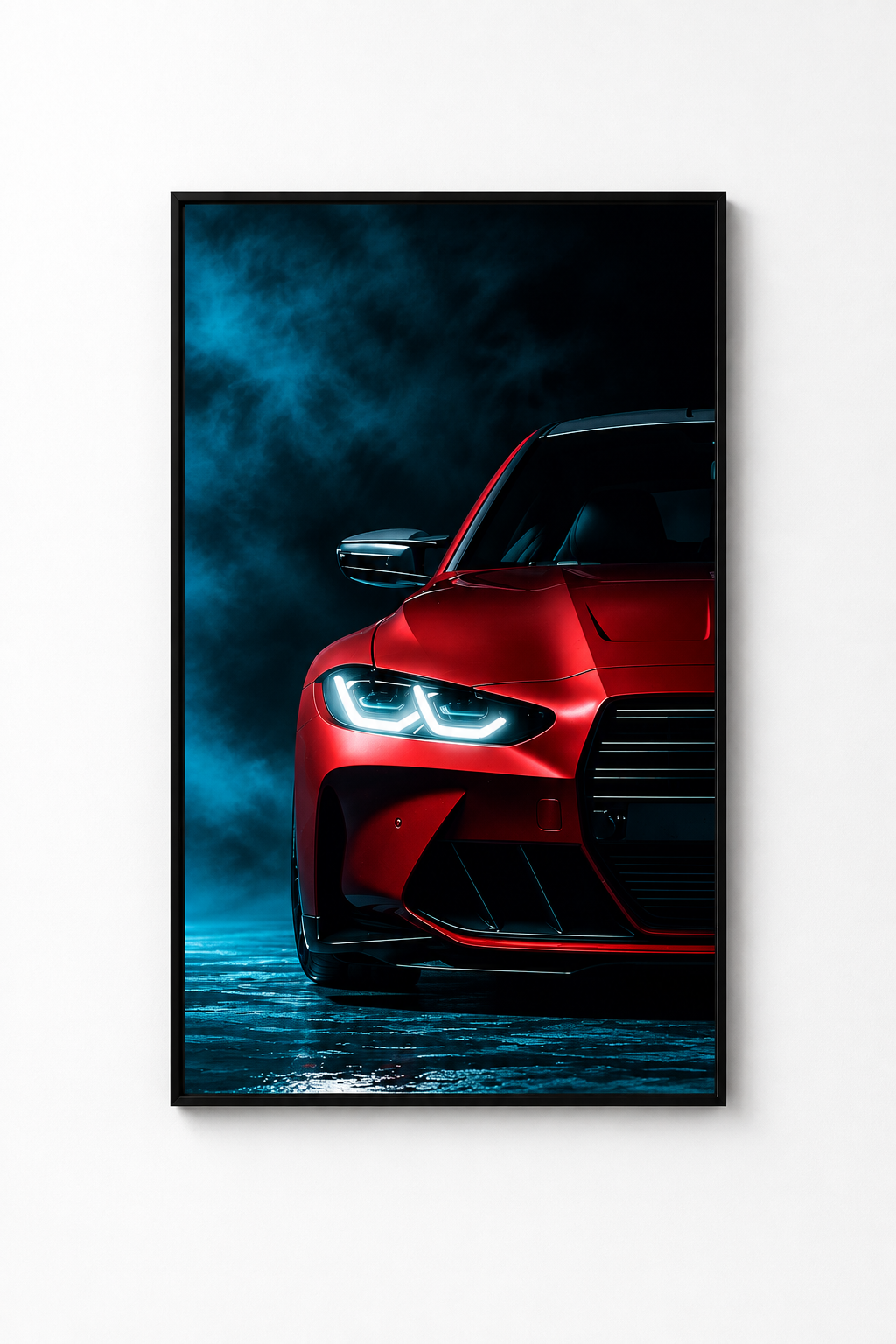 A framed vertical art print featuring a close-up of a red sports car with glowing headlights against a dark blue and black smoky background, displayed on a clean white wall.